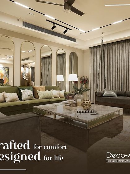 Crafted for comfort, designed for life. This living room is a haven of tranquility and beauty, featuring an olive green sofa, an array of mirrors to enhance space, and a stunning marble coffee table.