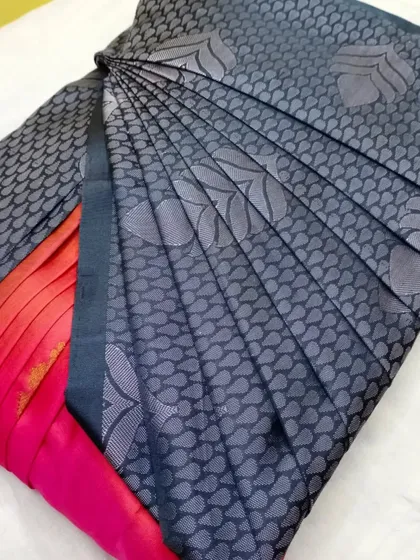 A grey and pink silk saree, pleated for the Diwali season.