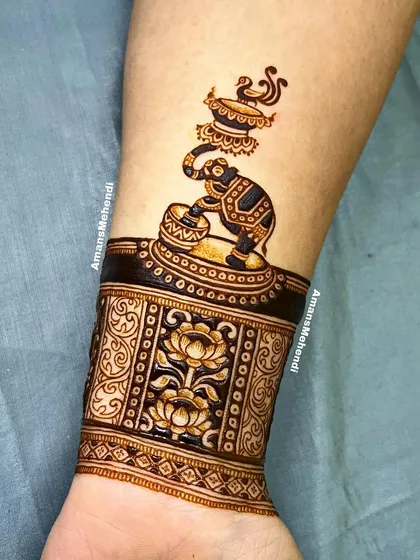 A unique wristband design featuring a ceremonial elephant, paired with a cuff of lotus flowers, showcasing my fine-line figurative work.