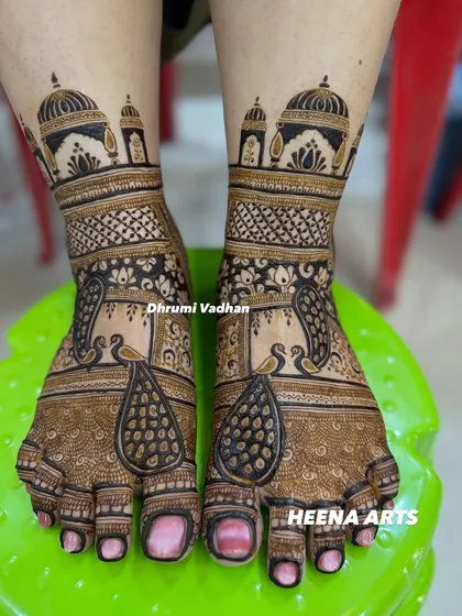 Don't forget the feet! I create intricate bridal mehendi for feet that complements your hand designs perfectly. This design features beautiful peacock and architectural motifs for a complete bridal look.