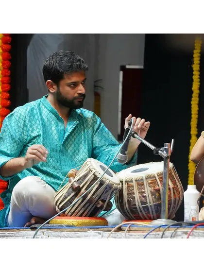 A candid moment of interaction with the main artist during the performance.