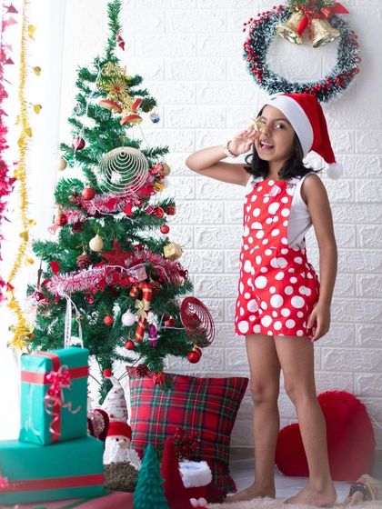 "Santa, I've been good this year!" Candid moments like this are what make Christmas mini sessions so special. This little girl is fully in character, creating a fun and memorable photo.