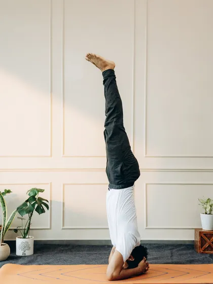 Salamba Sirsasana (Supported Headstand) is the king of asanas. This image shows a stable, aligned headstand, which builds upper body strength, calms the nervous system, and improves circulation.