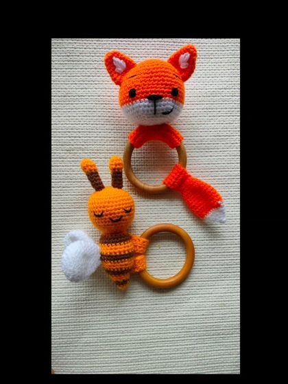 A cute fox and a sleepy bee rattle toy. The different shapes and textures are great for a baby's development.