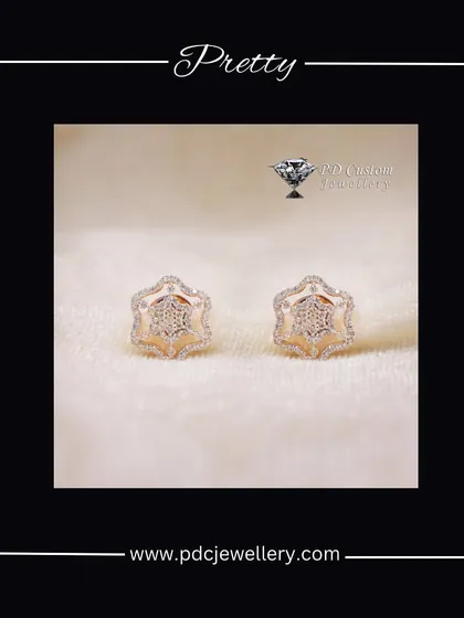 A pretty pair of star-shaped diamond earrings in 18kt rose gold. These are perfect for adding a whimsical and stylish touch to your look.