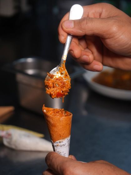 A look at the process of filling our cornetts. Each one is generously filled by hand, ensuring every bite is as flavourful as the last.