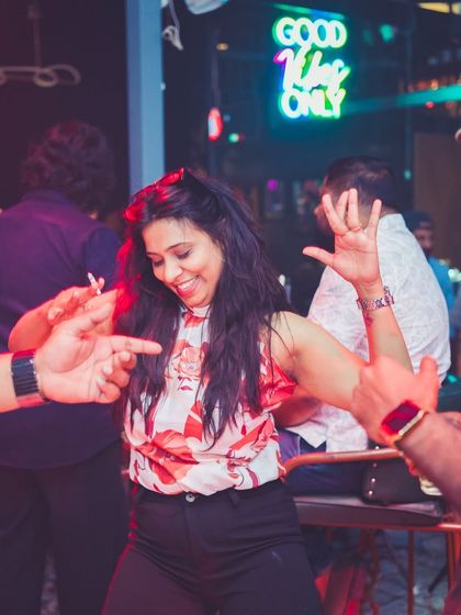 Good vibes only, as the sign says. A guest enjoying the dance floor.