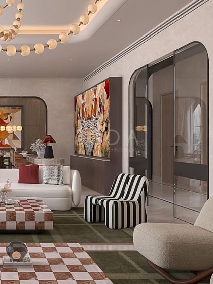This view shows the arched doorways and layered artwork in a mid-century modern concept. The design ensures that even with bold patterns and colors, the space feels cohesive and thoughtfully curated.