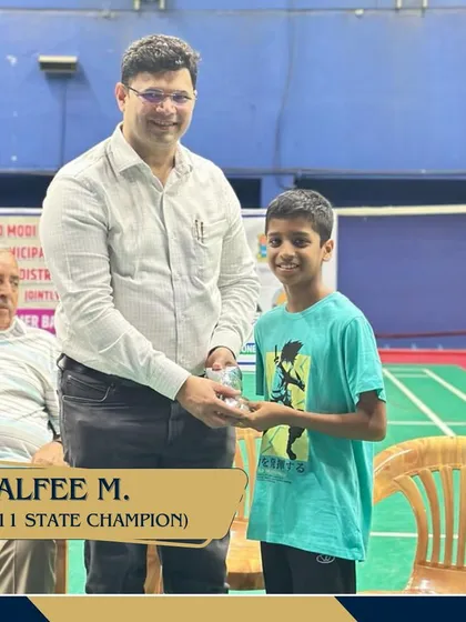 Alfee M., our U11 State Champion, being felicitated for his success. We believe in celebrating our players' victories.