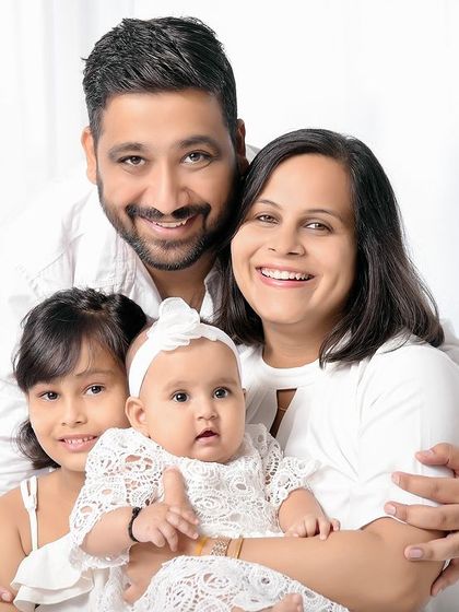 A beautiful portrait of a family of four, with two daughters. It's always special when clients return, and we were honored to capture this family again after eight years.