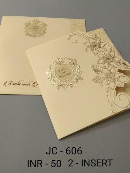 A simple and affordable cream-colored card with a delicate floral die-cut. This design is also available in other colors to match your wedding theme.