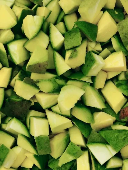 Freshly chopped raw mangoes. This is where the journey of my famous mango pickles begins.