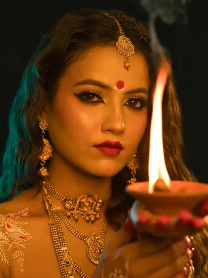A captivating look of Maa Shailaputri, the first form of Durga, holding a diya.