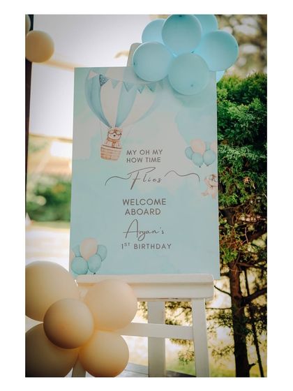 A 'Welcome Aboard' sign for Ayan's 1st birthday, perfectly setting the tone for a travel or airplane-themed adventure.