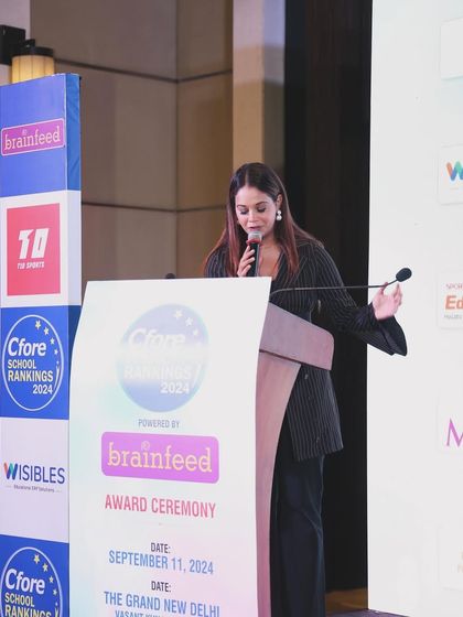 In my element at the podium, hosting the Brainfeed School Rankings Award Ceremony.