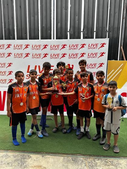 Our U11 team celebrates their runners-up finish in the Junior Football League.