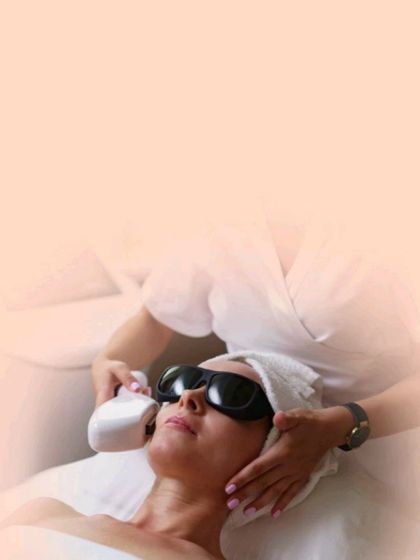 Here is a patient undergoing a laser hair reduction session. The procedure is comfortable, with the patient wearing protective eyewear as the laser handpiece is applied to the treatment area.