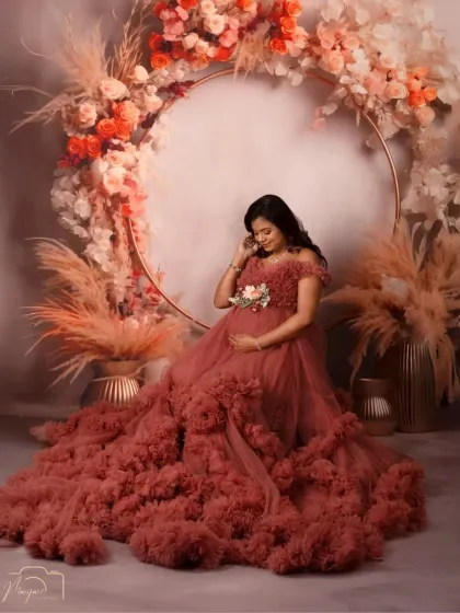 A quiet moment of reflection for this mama-to-be, seated gracefully in front of the boho ring. The ruffled gown adds so much texture and drama.