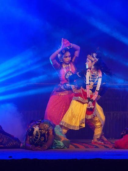 A dynamic scene from our "KRISHNA" production at the Udupi Sri Krishna Matha. The combination of blue stage lights and fog creates a mystical setting for the dance.