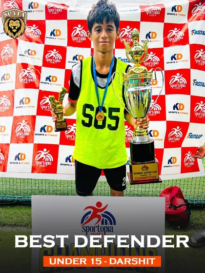Darshit, named Best Defender for the Under 15s, holding his trophy. A strong defense is the foundation of a championship team.