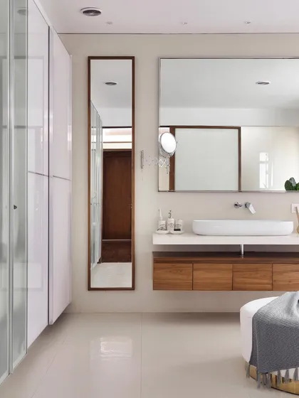 The full view of the master bath in 'A Walk in the Clouds', showcasing the spacious layout, floating vanity, and full-length wardrobe.