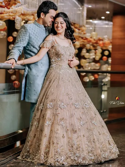 A happy, candid portrait of the couple during their Sagan ceremony, their smiles reflecting the joy of the occasion.