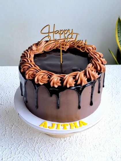 A classic chocolate truffle cake. I teach how to create a rich chocolate ganache, a perfect drip, and how to pipe beautiful rosettes on top.
