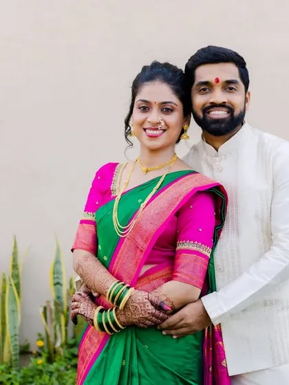A classic portrait of the newly engaged couple, Asawari and Amit. Their coordinated outfits and bright smiles radiate happiness.