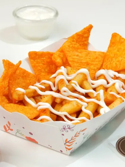 Loaded fries are a top seller. We style them to look abundant and messy in an appealing way, with the sauces and toppings clearly visible, perfect for an appetizer section.