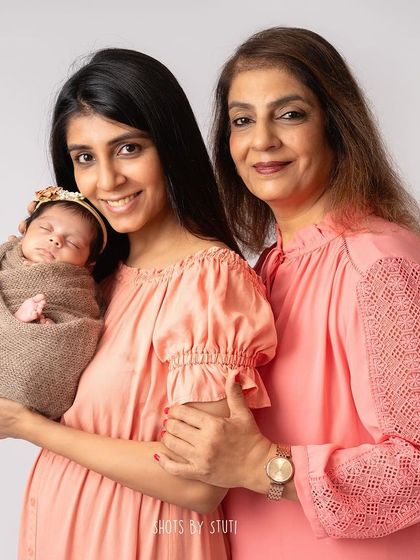 Another pose with three generations, showing the love that flows from one generation to the next.