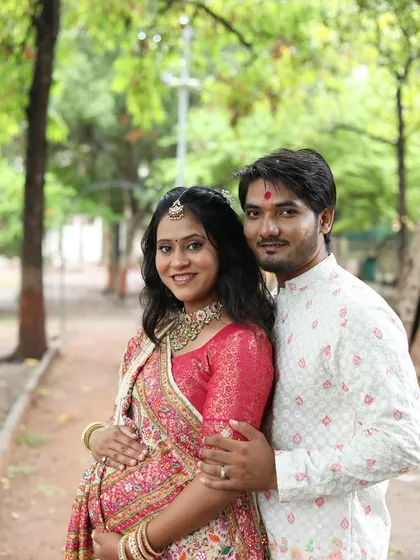 A happy couple portrait from the baby shower. Both are beaming, and her makeup is designed to look fresh and radiant throughout the event.