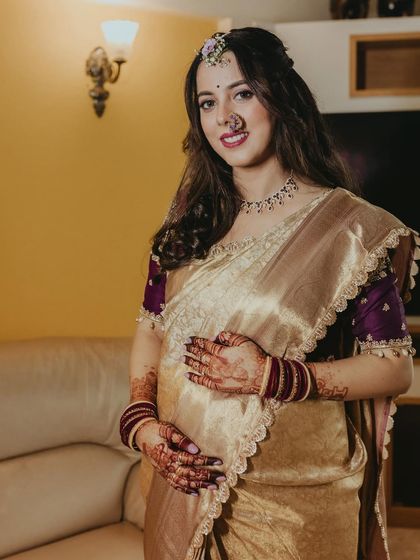 A beautiful portrait of the mom-to-be, cradling her baby bump. The makeup is soft and enhances her pregnancy glow.