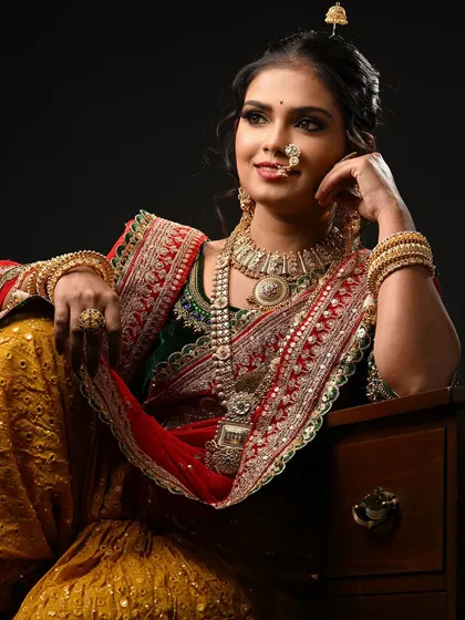 Another angle of the Maharashtrian bridal look, showing how the hair is styled to support the traditional jewelry. I emphasize creating a strong foundation in hairstyling.