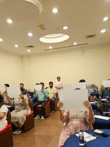 Participants using whiteboards for a visualization exercise during the workshop. This helps to train the mind's eye.