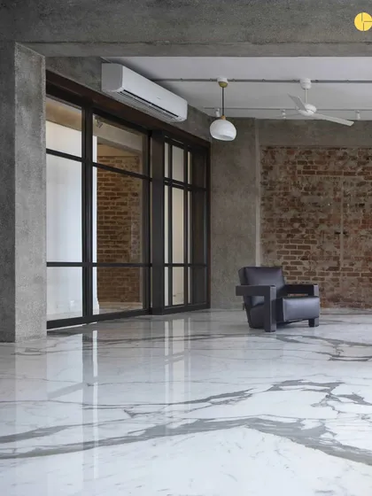 The bare shell of 'The Canvas,' with its marble floors and raw concrete pillars. This initial phase is about understanding the fundamental structure and potential of a space before we begin to shape it.