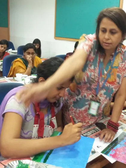I believe in guiding every student personally, no matter the size of the group. Here at a Wipro workshop, I am helping a participant find her flow. My role is to be a gentle guide, ensuring everyone feels supported and leaves with a smile and a masterpiece.