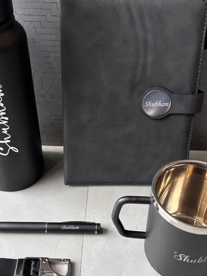 Personalization is key to making a gift special. Here is an example of a gift set where the name 'Shubham' is elegantly engraved on the bottle, diary clasp, mug, pen, and keychain. This kind of detailed personalization is perfect for birthdays, anniversaries, or just to show someone you care.