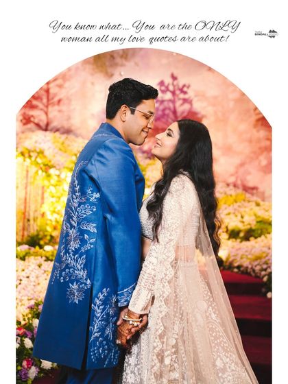 "You are the ONLY woman all my love quotes are about!" A romantic portrait of the couple at their reception, framed by a beautiful floral arch.