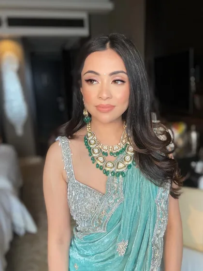 A close-up of Sanam's makeup, showing the clean lines and radiant skin finish.