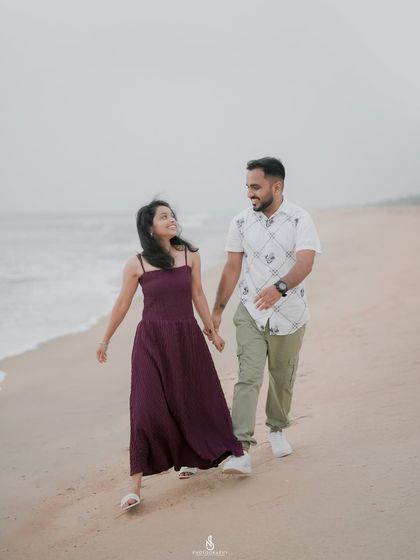 A happy, candid walk along the beach. The movement in her dress and the genuine smiles make this a lively and beautiful shot.