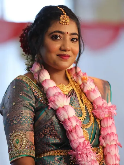 A classic South Indian Muhurtham look for this beautiful bride. I created a flawless, long-lasting base to complement her silk saree and temple jewellery, ensuring she glowed through all the ceremonies of her big day.