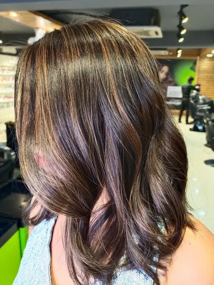 This client's caramel highlights give her hair a healthy, glossy finish.