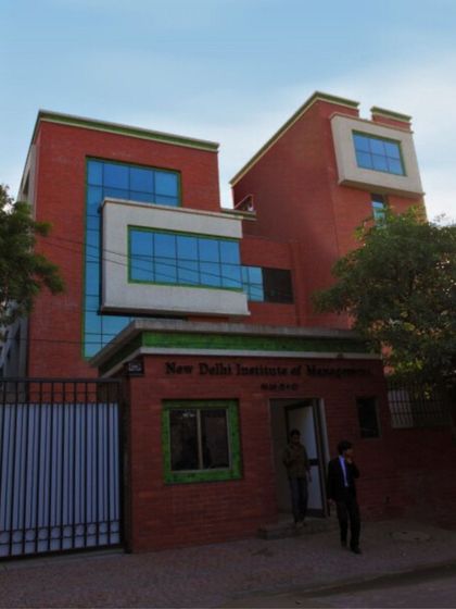 The entrance to the New Delhi Institute of Management, where we used a mix of exposed brick and modern glass elements. The design creates a strong visual identity for the institution.