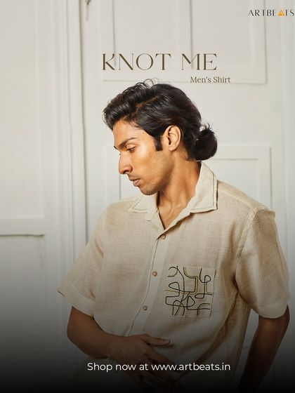 The Knot Me men's shirt in a natural linen blend. The pocket features a simple yet intriguing abstract line art design, adding a touch of modern artistry to a timeless piece.