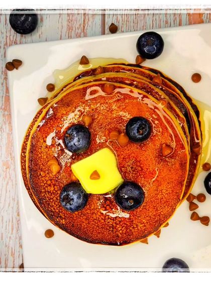 Healthy and delicious protein pancakes topped with blueberries and chocolate chips. A great recipe for anyone looking for a nutritious breakfast option.