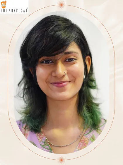 A pop of green gives this textured, layered short cut an eco-friendly and fashionable vibe. This is for someone who isn't afraid to make a statement.