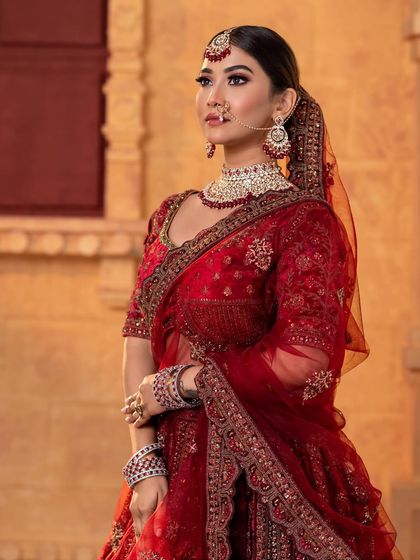 A side profile of the North Indian bridal look, showcasing the hairstyle and dupatta setting.