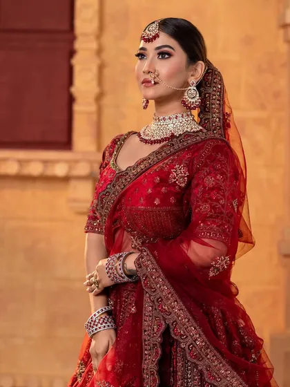 A side profile of the North Indian bridal look, showcasing the hairstyle and dupatta setting.