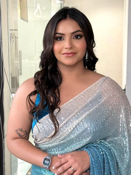 A gorgeous party makeup look featuring a silver and blue smokey eye. The skin is kept fresh and dewy to balance the dramatic eye makeup.