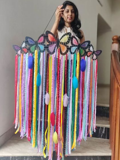 Spread your wings and fly high. This vibrant rainbow dreamcatcher with butterfly accents is a reminder that you are destined to touch the sky.